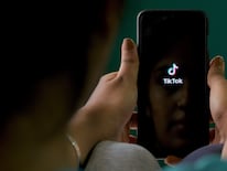 An Indian mobile user browses through the Chinese owned video-sharing 'Tik Tok' app on a smartphone in Bangalore on June 30, 2020. - TikTok on June 30 denied sharing information on Indian users with the Chinese government, after New Delhi banned the wildly popular app citing national security and privacy concerns.
“TikTok continues to comply with all data privacy and security requirements under Indian law and have not shared any information of our users in India with any foreign government, including the Chinese Government,” said the company, which is owned by China's ByteDance. (Photo by Manjunath Kiran / AFP)